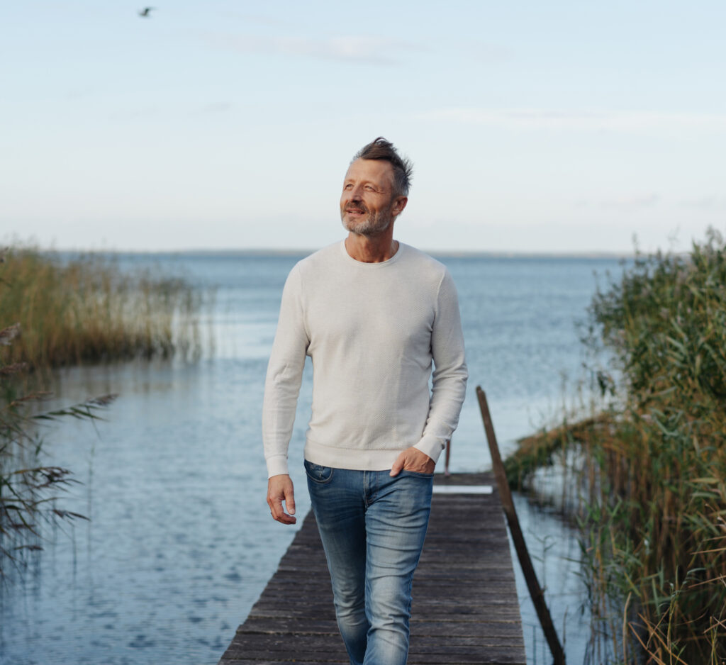 Man Walking down dock